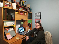 Image of Jess Chernich sitting at her desk